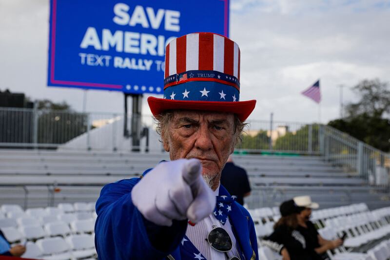 A man in costume arrives for a Republican party 'Save America' rally before the US midterm elections, in Miami, Florida. AFP