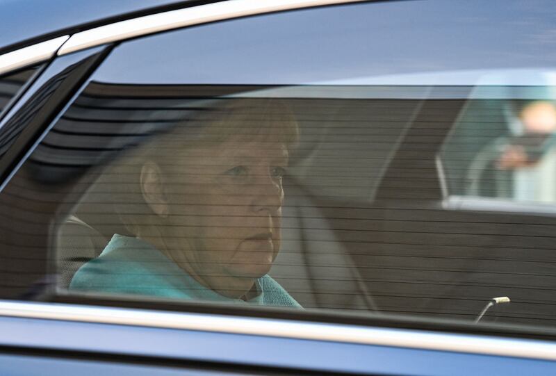Outgoing German Chancellor Angela Merkel arrives at the CDU headquarters. AFP