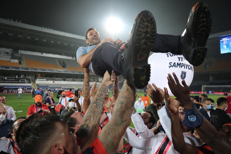 Basaksehir's head coach Okan Buruk and players celebrate winning the Turkish Super League Championship.  EPA