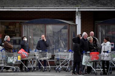 Shoppers queue to enter a Tesco supermarket, as the spread of the coronavirus disease continues, in west London, Britain. Reuters