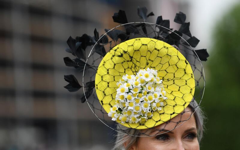 Worn high on the forehead, this hat is dazzling with daisy's set on a chartreuse ground.
