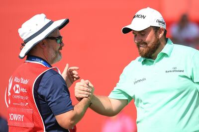 ABU DHABI, UNITED ARAB EMIRATES - JANUARY 16:  Shane Lowry of Ireland and caddie Brian "Bo" Martin react on the ninth green during Day One of the Abu Dhabi HSBC Golf Championship at Abu Dhabi Golf Club on January 16, 2019 in Abu Dhabi, United Arab Emirates. (Photo by Ross Kinnaird/Getty Images)