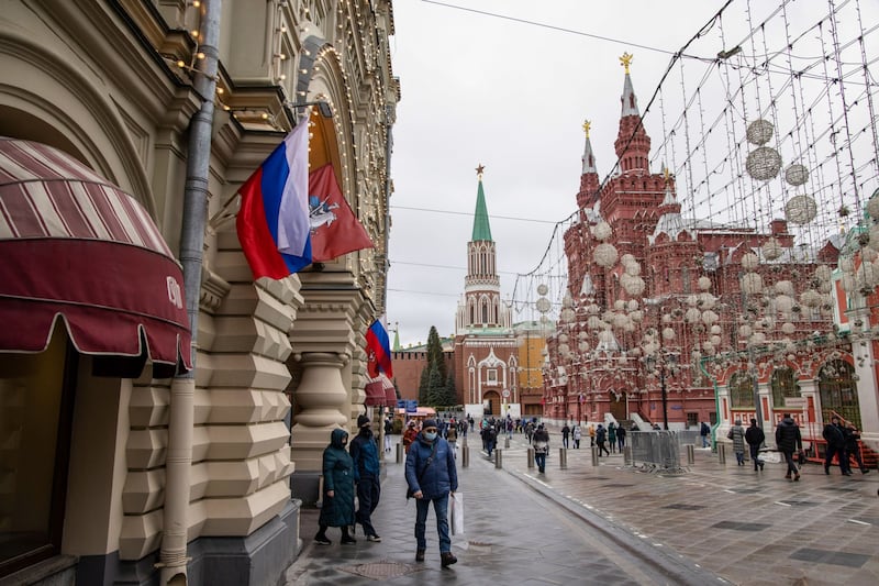Shoppers walk past a luxury department store in Red Square, Moscow. Bloomberg