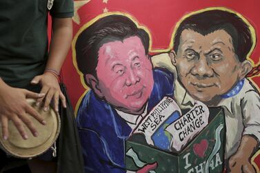 A placard with painting depicting Chinese President Xi Jinping and Philippine President Rodrigo Duterte during a protest near the Chinese Embassy in Manila, Philippines, 20 November 2018. EPA