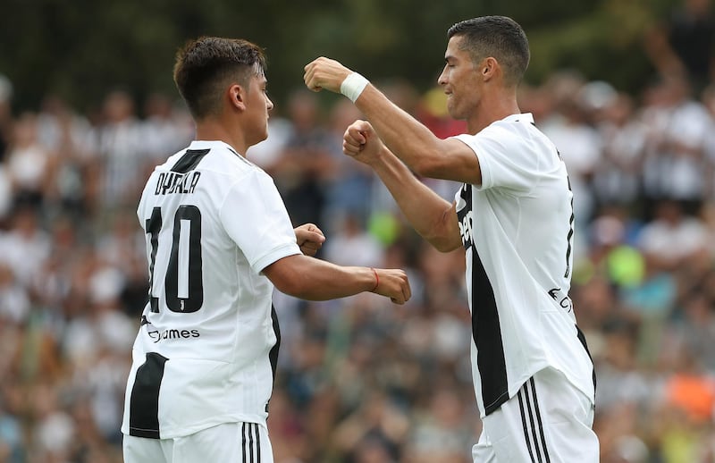 Ronaldo, right, celebrates with Paulo Dybala. Getty Images