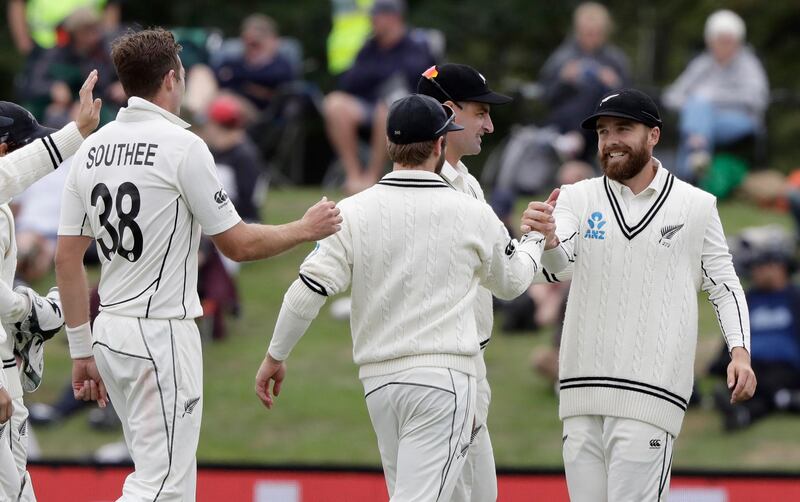 New Zealand's Tom Blundell, right, is congratulated by teammates after taking a catch to dismiss India's Mohammed Shami during day three of the second Test at the Hagley Oval in Christchurch on Monday. AP