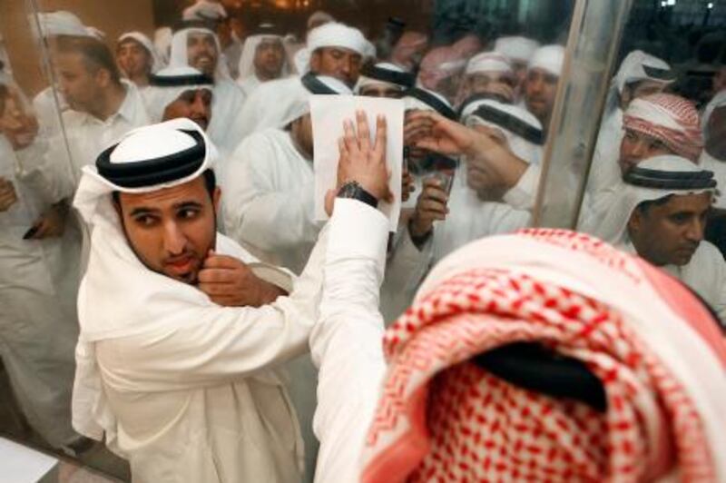 September 24. As results are made public officials post the results to waiting suporters at the Exhibition Center in Ras Al Khaimah city for the Federal National Council elections. September 24, Ras Al Khaimah, United Arab Emirates (Photo: Antonie Robertson/The National)