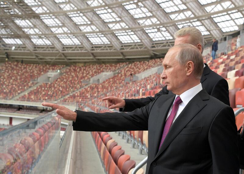 FILE PHOTO: Russian President Vladimir Putin listens to Moscow Mayor Sergei Sobyanin as they inspect the Luzhniki Stadium, which will host matches of the 2018 FIFA World Cup, in Moscow, Russia September 9, 2017. Sputnik/Alexei Druzhinin/Kremlin via REUTERS/File Photo ATTENTION EDITORS - THIS IMAGE WAS PROVIDED BY A THIRD PARTY.