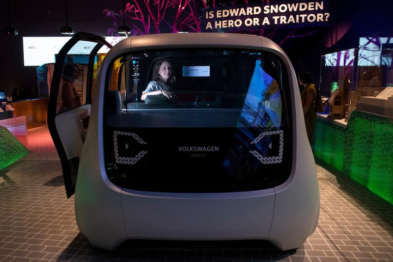 epa06721942 A member of the public looks from the inside of a Sedric' Volkswagen driverless concept car during a media preview of 'The Future Starts Here' Exhibition at the Victoria and Albert (V&A) Museum in central London, Britain, 09 May 2018. The exhibition features over 100 objects currently in development intended to bring further automation to the everyday tasks.  EPA/WILL OLIVER
