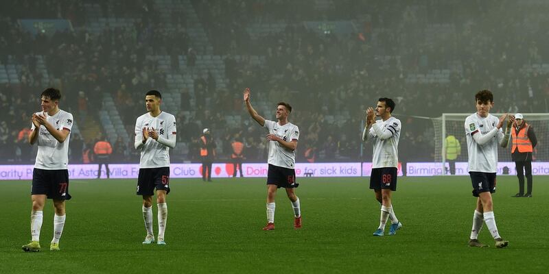 Liverpool's Scottish defender Tony Gallacher (C) applauds the fans following the League Cup quarter-final. AFP