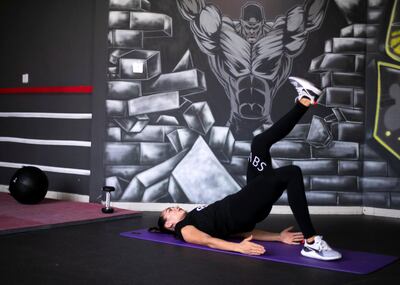 DUBAI, UNITED ARAB EMIRATES. 19 AUGUST 2019. 
Personal trainer, Olga Martinica, demostrates a single leg glute with a resistance band, an excercise part of the pre-natal and post-partum fitness at Super Boost Gym Al Barsha.

(Photo: Reem Mohammed/The National)

Reporter: HAFSA LODI
Section: LF