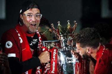 Liverpool's coach Jurgen Klopp lifts the Premier League trophy. EPA
