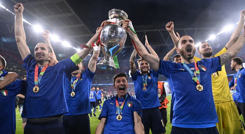 Italy celebrate with the trophy after they beat England 3-2 on penalties to win the Euro 2020 final at Wembley.  PA