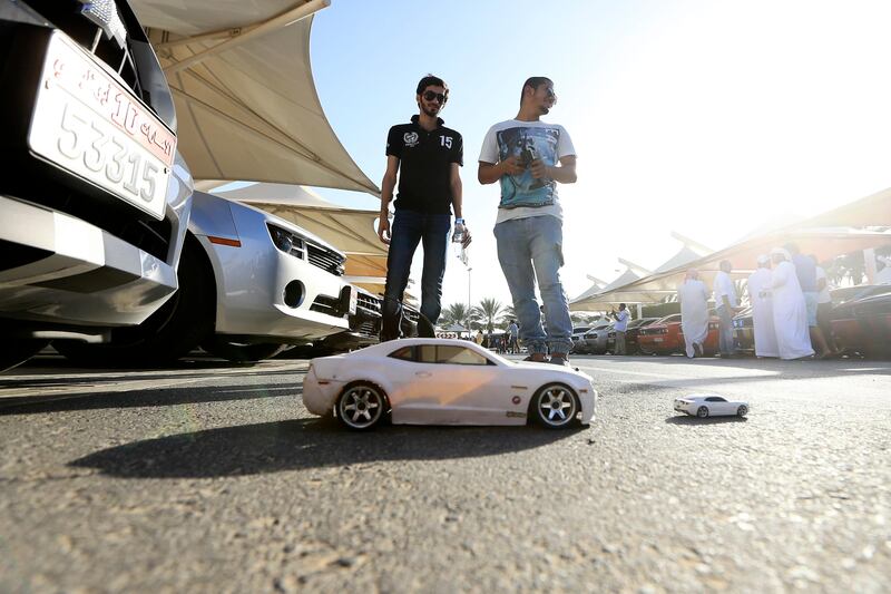 Dubai, May 31, 2013 - Ali Yaqoob and Bader Al Hammadi drive remote controlled Camaros at the Fast and Furious "Extreme Car Park" event at Studio City in Dubai, May 31, 2013. (Photo by: Sarah Dea/The National)

