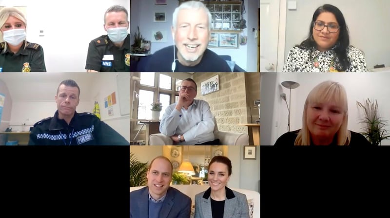 In this image provided by Kensington Palace shows a video call on Jan. 13, 2021 with Britain's Prince William and his wife Kate, Duchess of Cambridge, bottom of screen, and, top row from left, Carly Kennard and Jules Lockett, both of London Ambulance Service, Conal Devitt of Formby Primary Care Network and Manal Sadik, Associate Director for Equality, Diversity and Inclusion and Widening Participation at Guys and St. Thomas Hospital. Center row from left, Phil Spencer from Cleveland Police, Tony Collins, Just 'B' volunteer helpline call handler and CEO of North Yorkshire Hospice Care, and Caroline Francis, Just 'B' helpline support worker and nurse at North Yorkshire Hospice Care. The royal pair spoke with frontline workers and counsellors about the mental health impact of the COVID-19 crisis for those working on the frontline, and why it is vital that they are able to reach out for support at such a critical time. (Kensington Palace via AP)
