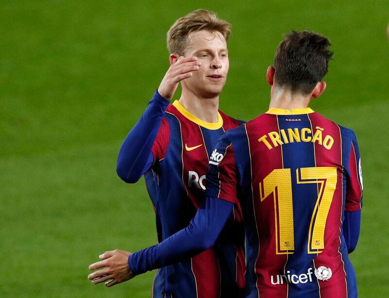 Barcelona's Francisco Trincao celebrates scoring their first goal with Frenkie de Jong. Reuters