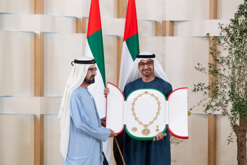 President Sheikh Mohamed awards the Order of Zayed to Sheikh Mohammed bin Rashid, Vice President and Ruler of Dubai, at a ceremony for Cop28 negotiators, officials and participants, at Erth Hotel in Abu Dhabi. All photos: UAE Presidential Court