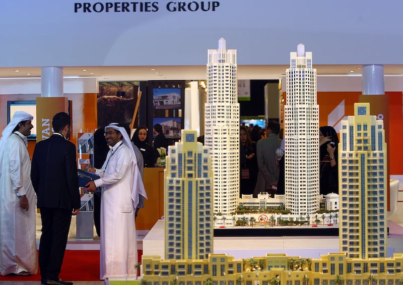 Dubai , United Arab Emirates- September 27,  2011:    Visitors browse the  Emaar Properties,  Down Town Dubai Projects  at  the Cityscape Global in Dubai.  ( Satish Kumar / The National ) For Business