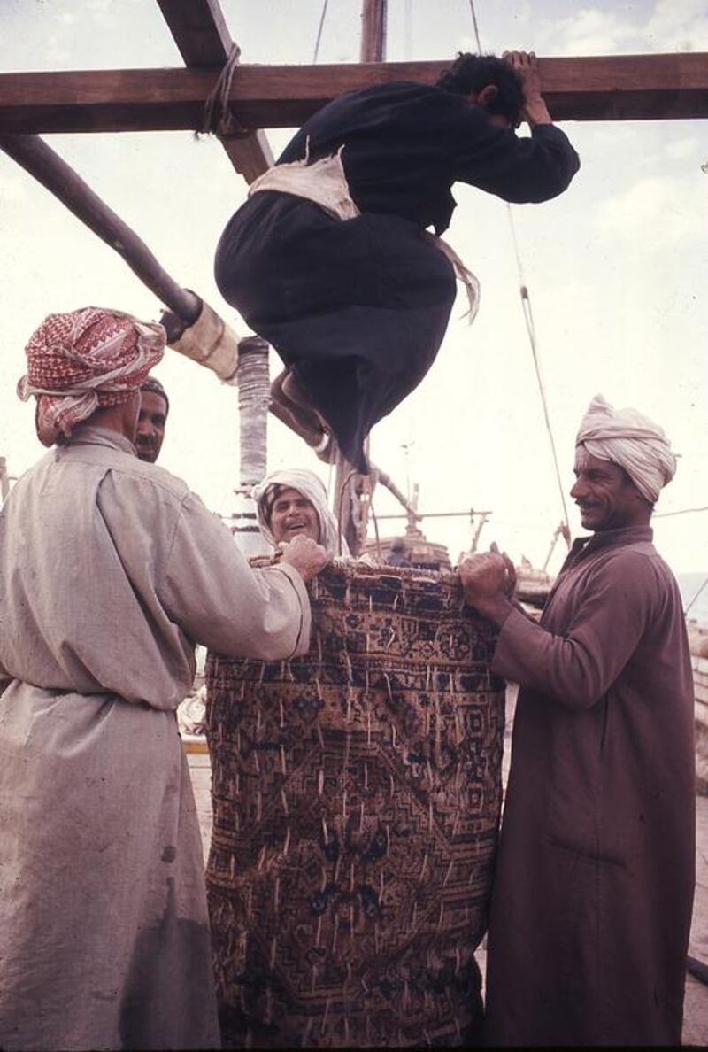 The crew bagging a sail.