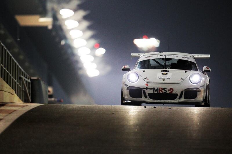The Porsche 997 GT3 entered by the MRS Molitor team navigates Yas Marina Circuit on Friday during the Gulf 12 Hours race on Friday. Christopher Pike / The National