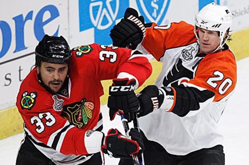 Philadelphia Flyers’ Chris Pronger, right, seemed comfortable on the ice after a surgery.