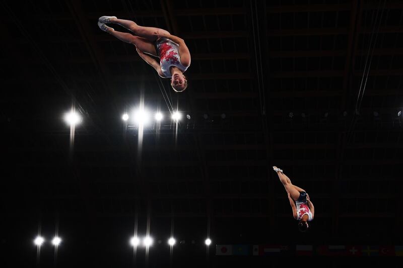 Samantha Smith, left, and Rachel Tam of Canada compete during the World Trampoline Gymnastics Championships at the Ariake Gymnastics Centre in Tokyo on Sunday, December 1. AFP
