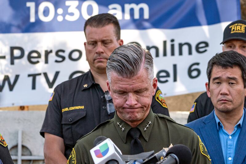 Jeff Hallock, of Orange County Sheriff's Department, takes questions from the media outside the church, where a man opened fire during a lunch reception before he was stopped in what the sheriff's office called an act of 'exceptional heroism and bravery'. AP Photo