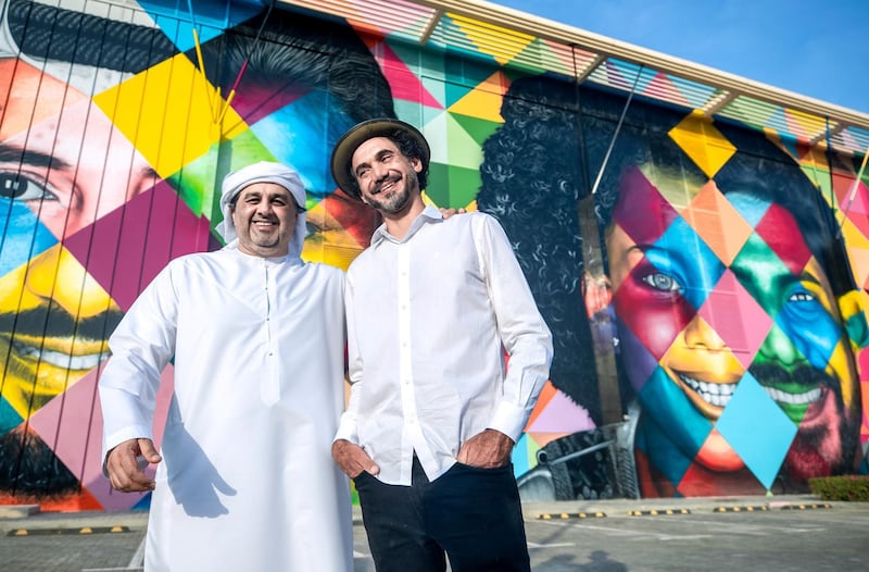 Abu Dhabi, United Arab Emirates, December 14, 2019.  
  -- STORY BRIEF:  DMT AbuDhabi is launching a street art initiative, commissioning artists around theworld to create murals across the city. The first to complete hisartwork/project is Brazilian artist Kobra – he will unveil his large-scale workon Saturday along with the chairman of DMT.  
--  Kobra with Mohamed Al Khadar Al Ahmed, Ecercutive Director of Strategic Affairs, Department of Municipalities and Transport, Abu Dhabi.

Section:  A&L
Reporter:  Alexandra Chaves
