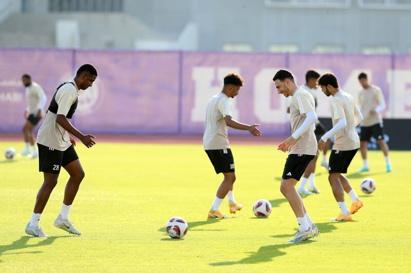 UAE players conduct a passing drill during a training session.
