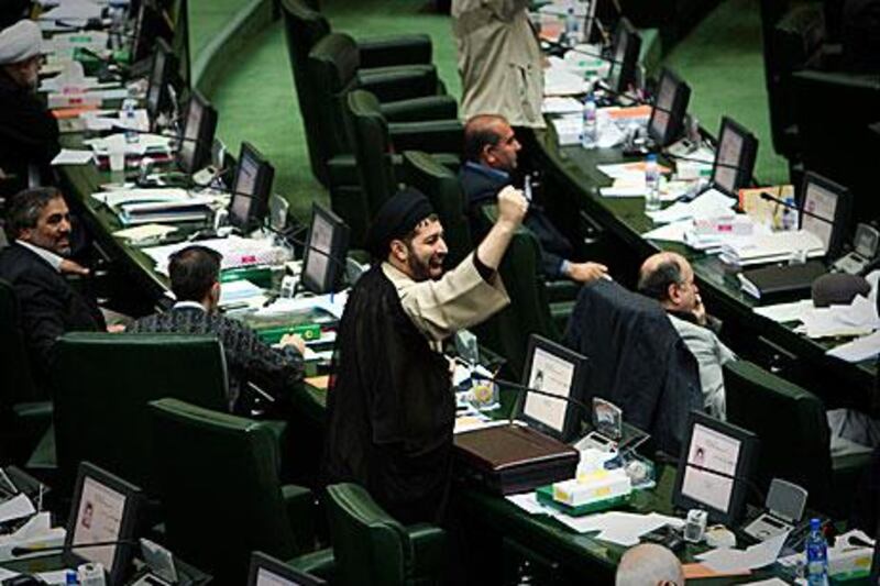 An Iranian MP chants anti-Britain slogans yesterday. The parliament approved a draft bill to slash diplomatic and economic relations with the UK after it increased sanctions on Tehran.