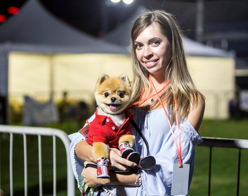 ABU DHABI, UNITED ARAB EMIRATES, 28 OCTOBER 2018 -A proud pet owner at the inaugural of Yas Pet Together event at Yas Du Arena, Abu Dhabi.  Leslie Pableo for The National for Evelyn Lau's story