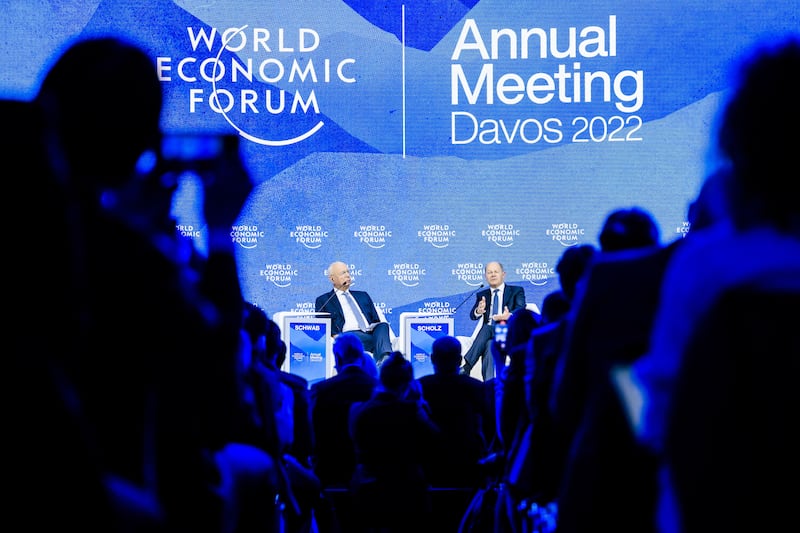 Klaus Schwab, founder and executive chairman of the World Economic Forum, and German Chancellor Olaf Scholz address a plenary session. EPA