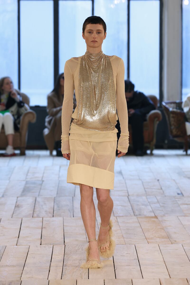 A drape-fronted metallic dress at Sportmax. Getty Images