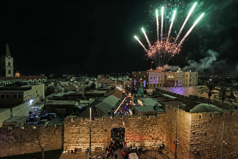 Fireworks at the lighting of a Christmas tree at the Jaffa Gate of the Old City of Jerusalem. AFP