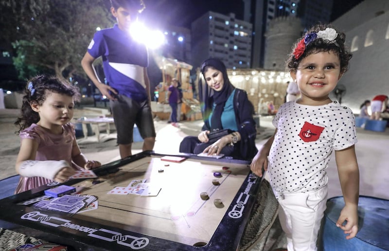 Abu Dhabi, United Arab Emirates, May 18, 2019. –  ‘Ramadan at Al Hosn’, which aims to revive the authentic traditions of Ramadan by recalling the memories rooted in our past, when the people of Abu Dhabi gathered at Qasr Al Hosn to celebrate the holy month.  -- Card games at Qasr Al Hosn.
Victor Besa/The National
Section:  NA
Reporter: