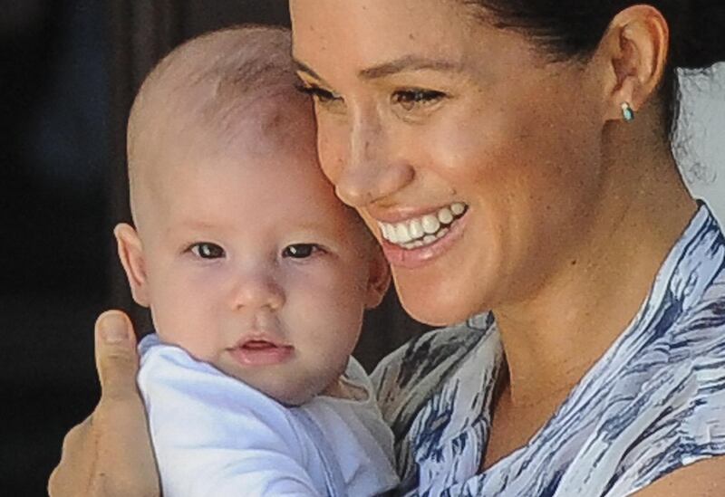 (FILES) In this file photo  Meghan, Duchess of Sussex holds her baby son Archie as she and Britain's Prince Harry, Duke of Sussex meet Archbishop Desmond Tutu and his wife Leah at the Tutu foundation in Cape Town on September 25, 2019. - Prince Harry and Meghan Markle announced on June 6, 2021 the birth of their daughter Lilibet Diana, who was born in California after a year of turmoil in Britain's royal family. "Lili is named after her great-grandmother, Her Majesty The Queen, whose family nickname is Lilibet. Her middle name, Diana, was chosen to honor her beloved late grandmother, The Princess of Wales," said a statement from the couple. (Photo by HENK KRUGER / POOL / AFP)