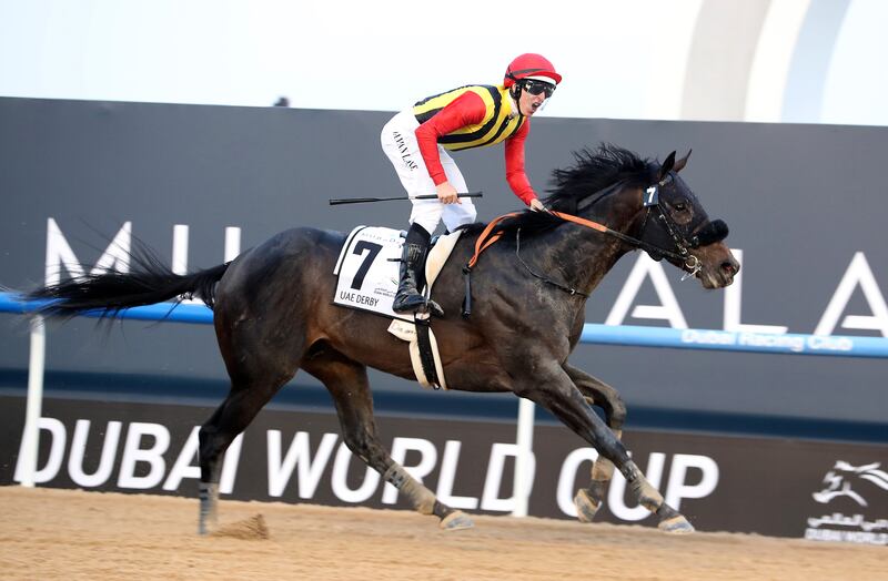 Crown Pride, ridden by  Damian Lane, wins the UAE Derby during the Dubai World Cup meeting. Pawan Singh / The National 