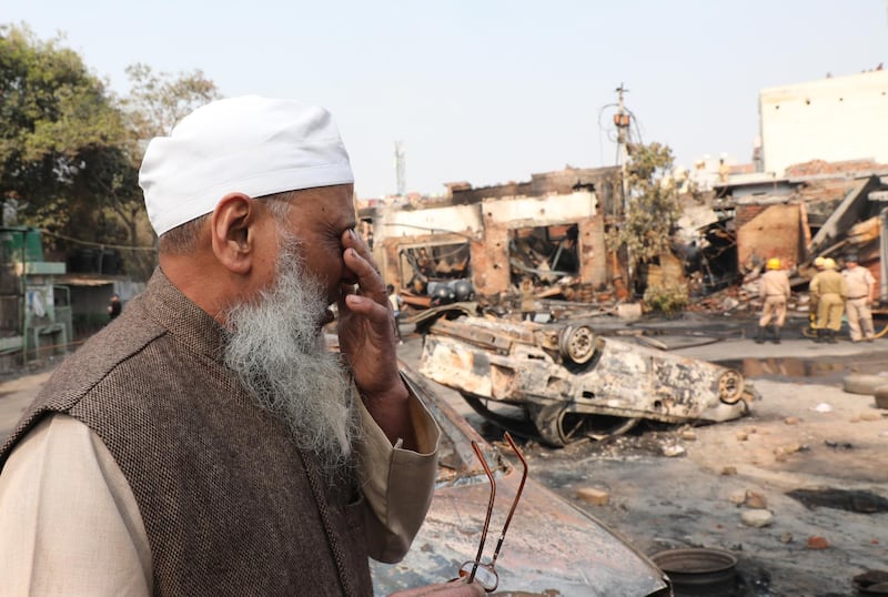 Indian Muslim man Abdul Hafiz reacts as he looks at the brunt Tyre market near Gokulpuri metro station after clashes in New Delhi, India.  EPA