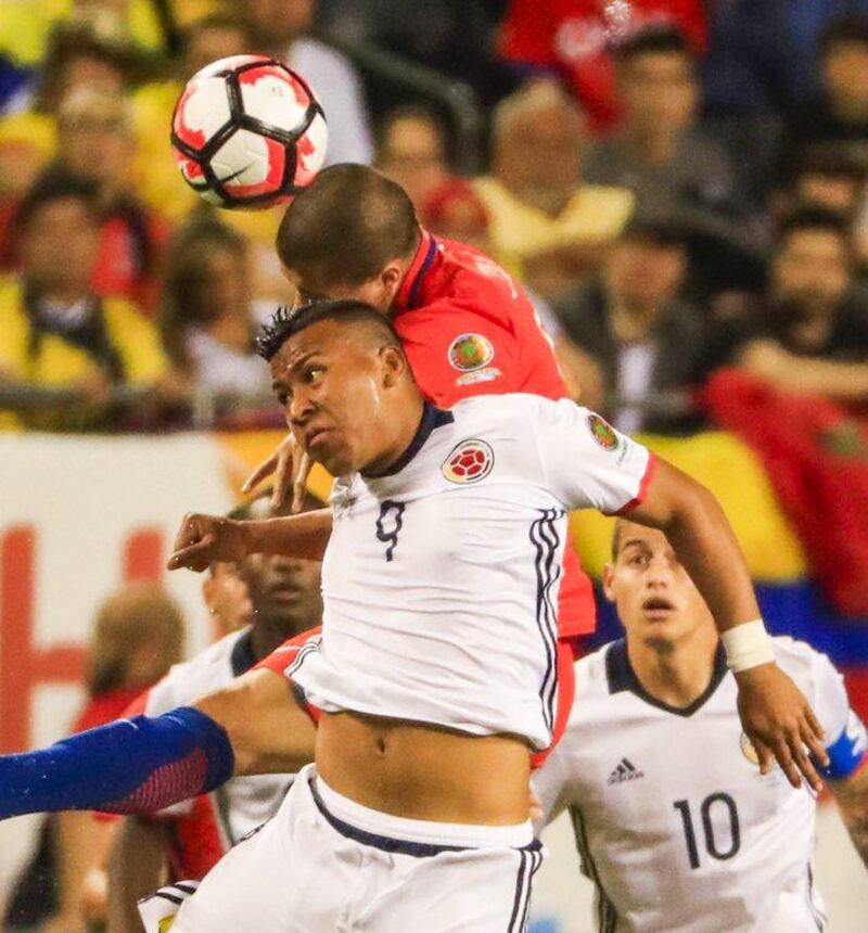 Colombian forward Roger Martinez (front) and Chilean midfielder Francisco Silva (rear) battle for the ball during the second half of the semifinal match of the COPA America Centenario 2016 between Chile and Colombia at Soldier Field in Chicago, Illinois, USA, 22 June 2016. Chile defeated Colombia and will face Argentina in the final match. EPA/TANNEN MAURY