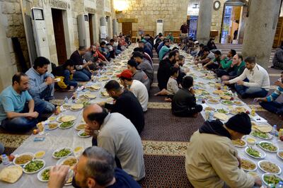 Muslims in Beirut sit down to break their Ramadan fast. Many around the world are celebrating the holy month amid an increase in food prices. EPA