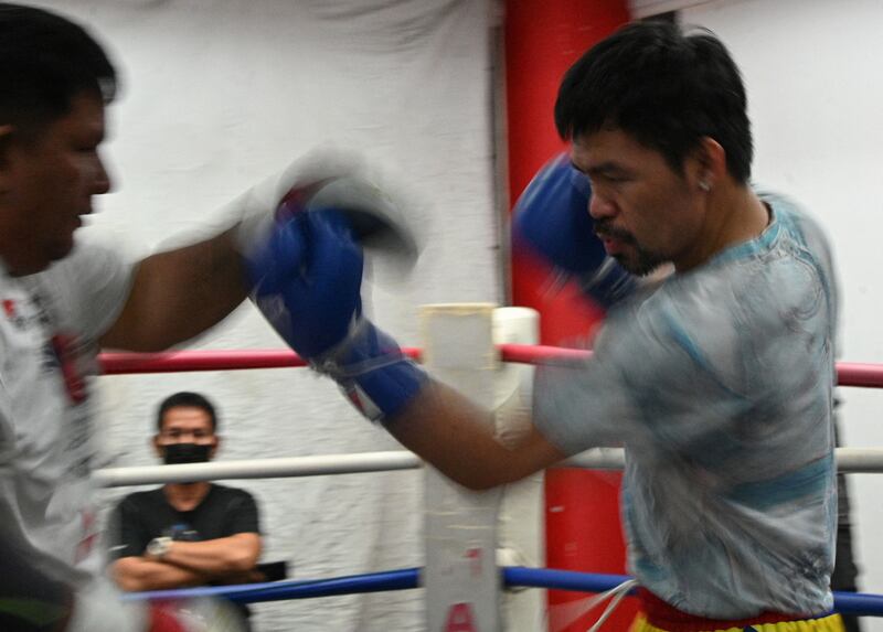 Manny Pacquiao (R) training with long-time associate Buboy Fernandez.