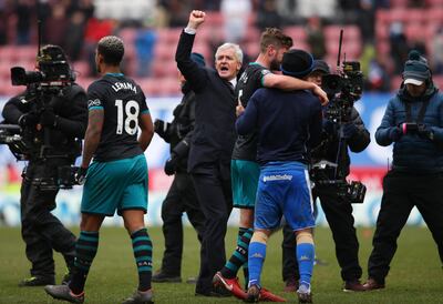 WIGAN, ENGLAND - MARCH 18:  Mark Hughes manager of Southampton (C) celebrates with players after victory in The Emirates FA Cup Quarter Final match between Wigan Athletic and Southampton at DW Stadium on March 18, 2018 in Wigan, England.  (Photo by Alex Livesey/Getty Images)