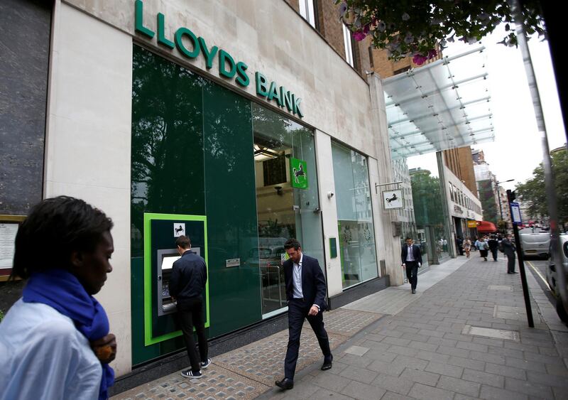FILE PHOTO: People walk past a branch of Lloyds Bank at Berkeley Square in London, Britain July 28, 2016.  REUTERS/Peter Nicholls/File Photo