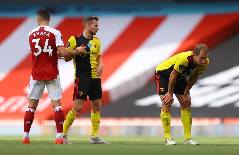 Watford's Craig Dawson and Tom Cleverley look dejected at the end of the match after being relegated from the Premier League. Reuters
