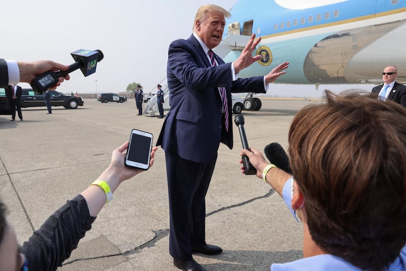 US President Donald Trump talks with reporters in front of Air Force One. Reuters