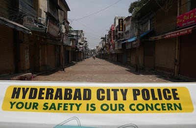 A signage is displayed at a closed market during a lockdown imposed to curb the spread of the coronavirus in Hyderabad, India, Thursday, May 13, 2021. With COVID-19 infections spinning out of control, many states have taken it upon themselves to either extend existing shut downs and curfews or add new stricter restrictions. The southern state of Telangana became the latest to announce a 10-day lockdown which started Tuesday. (AP Photo/Mahesh Kumar A.)