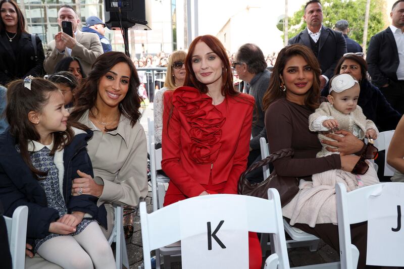 Danielle Jonas, Sophie Turner and Priyanka Chopra watch their partners' star unveiling ceremony in Los Angeles. Reuters