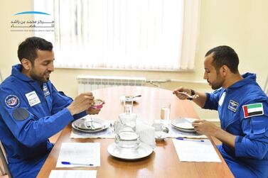 Maj Al Mansouri and his back-up astronaut Sultan Al Neyadi taste Russian-made halal space food at Star City in Russia. Courtesy: MBR Space Centre