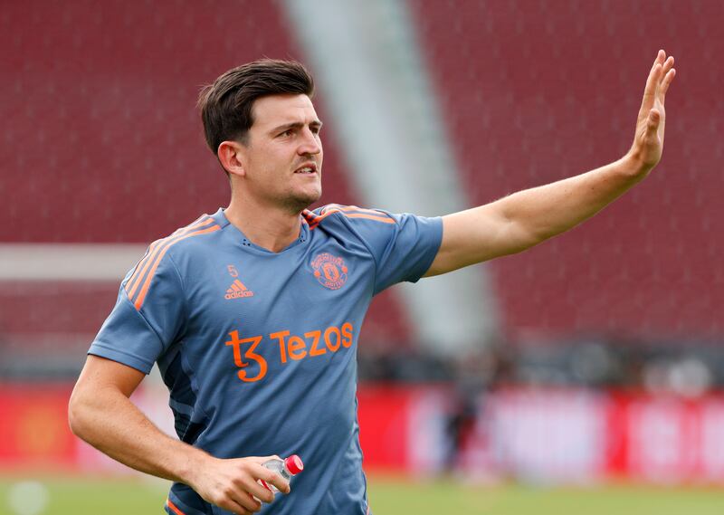United club captain Harry Maguire waves to fans in Bangkok. EPA