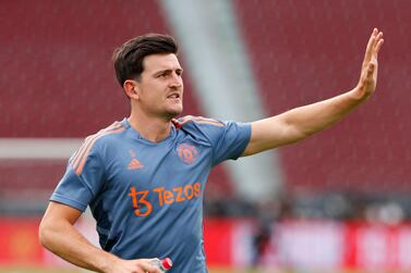 Manchester United's Harry Maguire greets fans during his team's training session for the pre-season tour soccer match between Manchester United and Liverpool FC at Rajamangala National Stadium in Bangkok, Thailand, 11 July 2022.  Manchester United will face Liverpool FC in their Bangkok Century Cup pre-season tour soccer match on 12 July 2022 in Bangkok.   EPA / RUNGROJ YONGRIT